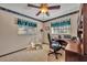 Home office featuring ceiling fan, neutral carpet and wallpaper at 4130 Floralwood Ct, Orlando, FL 32812