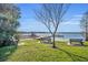 Picturesque lake view with benches and dock, offering a serene waterfront experience at 4130 Floralwood Ct, Orlando, FL 32812