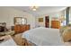 Spacious main bedroom with carpet floors, cream walls and vintage wood dresser at 4130 Floralwood Ct, Orlando, FL 32812