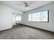 Bright bedroom with mirrored closet doors and carpeting at 5381 Vineland Rd # S, Orlando, FL 32811