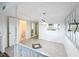 Condo dining area with tiled flooring and adjacent kitchen at 5381 Vineland Rd # S, Orlando, FL 32811