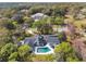 Aerial view showcasing the home, pool, and surrounding landscape at 601 Sweetwater Club Blvd, Longwood, FL 32779