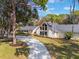 Stunning aerial view showcasing the home's curb appeal and private backyard oasis at 601 Sweetwater Club Blvd, Longwood, FL 32779