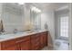 Bathroom with double vanity and marble countertop at 601 Sweetwater Club Blvd, Longwood, FL 32779