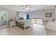 Bright bedroom with queen-size bed and access to backyard at 601 Sweetwater Club Blvd, Longwood, FL 32779