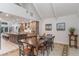 Formal dining room with a rustic wooden table and seating for six at 601 Sweetwater Club Blvd, Longwood, FL 32779