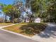 Stunning home exterior with manicured lawn and long driveway at 601 Sweetwater Club Blvd, Longwood, FL 32779