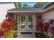 Welcoming entryway with double doors and lush landscaping at 601 Sweetwater Club Blvd, Longwood, FL 32779