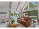 Relaxing living room with sliding doors leading to the pool area at 601 Sweetwater Club Blvd, Longwood, FL 32779