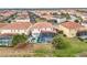 Aerial view of house and community with pools at 6156 Broad Oak Dr, Davenport, FL 33837