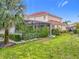 Landscaped backyard with lush greenery at 6156 Broad Oak Dr, Davenport, FL 33837