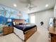 Spacious bedroom with pirate theme, king-size bed, and custom mural at 6156 Broad Oak Dr, Davenport, FL 33837