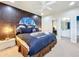 Bedroom with space theme, queen-size bed, and custom mural at 6156 Broad Oak Dr, Davenport, FL 33837