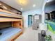 Bunk bed bedroom with wood-themed decor and mountain mural at 6156 Broad Oak Dr, Davenport, FL 33837