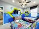 Toy Story themed bedroom with two twin beds at 6156 Broad Oak Dr, Davenport, FL 33837