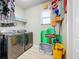 Laundry room with washer, dryer, and fun game room theme at 6156 Broad Oak Dr, Davenport, FL 33837