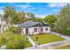 Aerial view of a charming house with a landscaped yard at 631 Callahan St, Winter Park, FL 32789