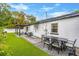 Patio area with pergola, table, chairs, and artificial turf at 631 Callahan St, Winter Park, FL 32789