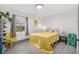 Bright bedroom with a yellow bedspread and a cheerful decor at 631 Callahan St, Winter Park, FL 32789