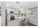 Modern kitchen with white cabinets, stainless steel appliances at 631 Callahan St, Winter Park, FL 32789