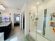 Bathroom with walk-in shower and double vanity at 6976 Church Lake St, Groveland, FL 34736