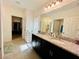 Bathroom with granite countertops and double sinks at 6976 Church Lake St, Groveland, FL 34736