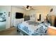 Spacious bedroom with dresser and large bed at 6976 Church Lake St, Groveland, FL 34736