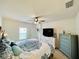 Bright bedroom with a king-size bed and TV at 6976 Church Lake St, Groveland, FL 34736