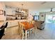 Bright dining area with wood table and chairs, flows into living room at 6976 Church Lake St, Groveland, FL 34736