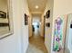 A long hallway with decorative accents leading to other rooms at 6976 Church Lake St, Groveland, FL 34736