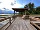 Scenic wooden dock with gazebo overlooking tranquil lake at 6976 Church Lake St, Groveland, FL 34736