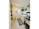 Laundry room with washer, dryer, and shelving at 6976 Church Lake St, Groveland, FL 34736