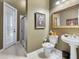 Small bathroom with toilet, sink, and shower at 7718 Flemingwood Ct, Sanford, FL 32771