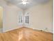 Hardwood floor bedroom with ensuite bathroom access at 7718 Flemingwood Ct, Sanford, FL 32771