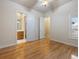 Hardwood floor bedroom with ensuite bathroom access at 7718 Flemingwood Ct, Sanford, FL 32771