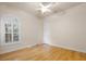 Hardwood floor bedroom with large windows and ceiling fan at 7718 Flemingwood Ct, Sanford, FL 32771