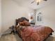 Bright bedroom with double windows, ceiling fan, and hardwood floors at 7718 Flemingwood Ct, Sanford, FL 32771