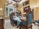 Bright dining room with large windows and a formal dining table at 7718 Flemingwood Ct, Sanford, FL 32771