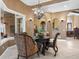 Elegant formal dining room with a chandelier and ornate furniture at 7718 Flemingwood Ct, Sanford, FL 32771