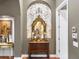 Elegant entryway with ornate mirror and console table at 7718 Flemingwood Ct, Sanford, FL 32771