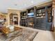 Living room with fireplace and built in shelving at 7718 Flemingwood Ct, Sanford, FL 32771