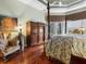 Main bedroom with antique armoire and hardwood floors at 7718 Flemingwood Ct, Sanford, FL 32771