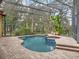 Relaxing pool and spa area with screened enclosure at 7718 Flemingwood Ct, Sanford, FL 32771