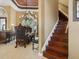 Elegant wooden staircase leading to upper level at 7718 Flemingwood Ct, Sanford, FL 32771