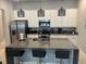 Modern kitchen with stainless steel appliances and an island at 7770 Sandy Ridge Dr # 126, Reunion, FL 34747