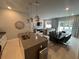 Modern kitchen with stainless steel appliances and an island at 7770 Sandy Ridge Dr # 126, Reunion, FL 34747