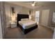 Spacious main bedroom with king-size bed and en-suite bathroom at 7770 Sandy Ridge Dr # 126, Reunion, FL 34747