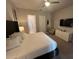 Spacious main bedroom with king-size bed, TV, and en-suite bathroom at 7770 Sandy Ridge Dr # 126, Reunion, FL 34747