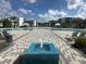 Large resort-style pool with central fountain and lounge chairs at 7770 Sandy Ridge Dr # 126, Reunion, FL 34747