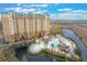 Luxury resort with a large pool, pirate ship, and surrounding landscape at 8101 Resort Village Dr # 31308, Orlando, FL 32821